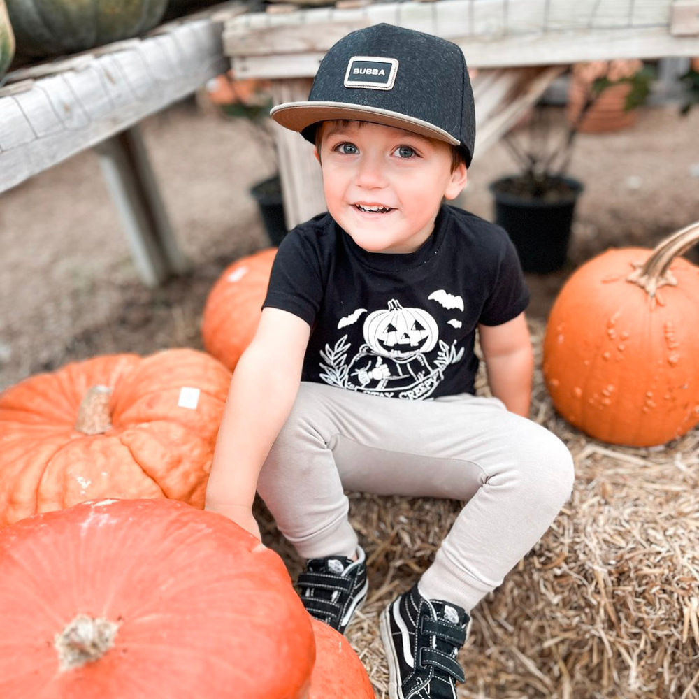 Tahoe Bubba Snapback hat for infants, toddlers, and youth, shown with a medium-profile, structured 5-panel crown and flat bill for a stylish, modern look. Featuring the Knuckleheads patch on a durable, soft blend of 50% wool, 30% rayon, and 20% polyester, with an adjustable snapback closure for a growing fit. Perfect for outdoor adventures and everyday wear