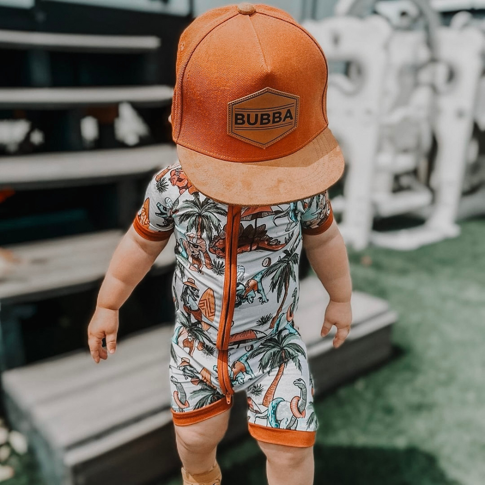 Image of Orange Kids Trucker Hat with 'Bubba' Patch: A vibrant and stylish accessory designed for kids. In a lively orange hue, it features a playful 'Bubba' patch on the front. Elevate your child's style with this fashionable hat, perfect for adding a pop of color to their outfits. Crafted with care, this orange kids trucker hat with the 'Bubba' patch is a must-have addition to their wardrobe, suitable for various occasions and everyday wear.