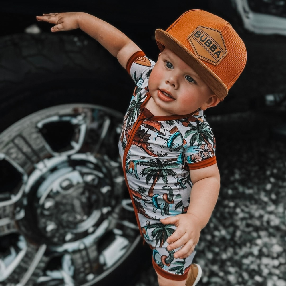 Image of Orange Kids Trucker Hat with 'Bubba' Patch: A vibrant and stylish accessory designed for kids. In a lively orange hue, it features a playful 'Bubba' patch on the front. Elevate your child's style with this fashionable hat, perfect for adding a pop of color to their outfits. Crafted with care, this orange kids trucker hat with the 'Bubba' patch is a must-have addition to their wardrobe, suitable for various occasions and everyday wear.