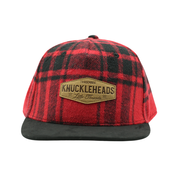 Cabin Christmas Lumberjack Snapback Hat for infants, toddlers, and youth. Featuring a festive lumberjack-inspired design in vibrant holiday colors with an adjustable snapback fit, perfect for family gatherings, photo sessions, and cozy winter adventures