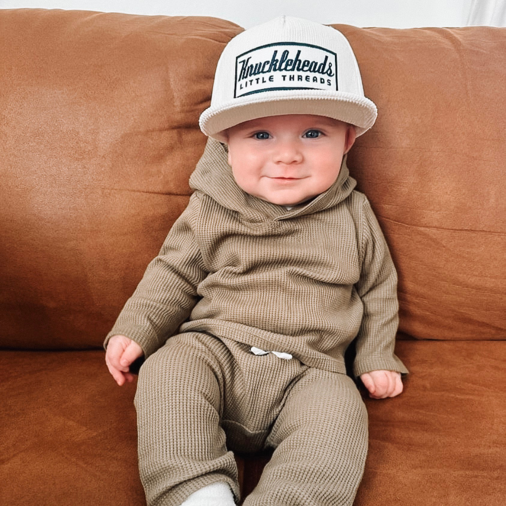 infant Off-White Corduroy Snapback Hat on little baby