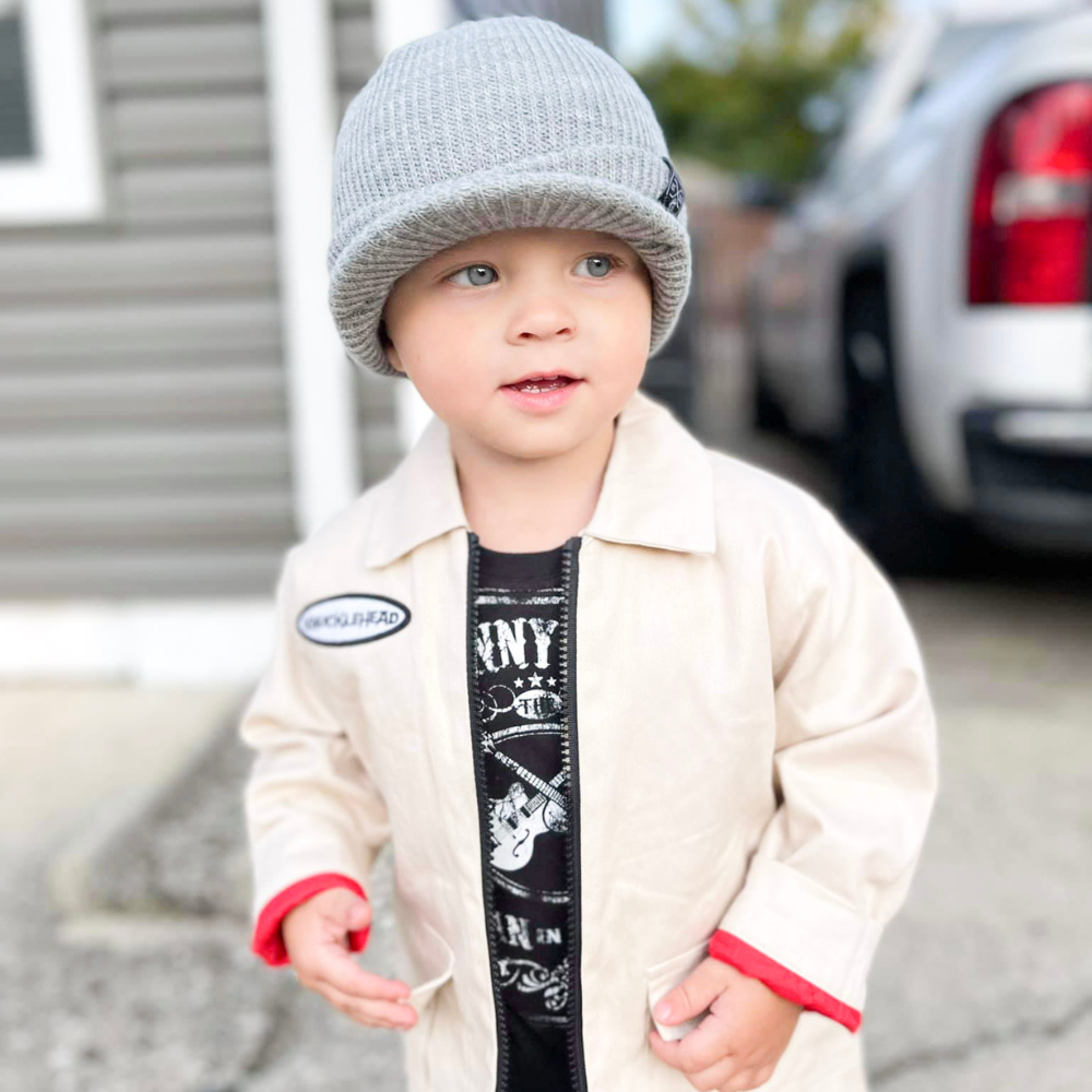 Tan Knuckleheads Mechanic Jacket with long sleeves, featuring the Knuckleheads logo. Perfect for keeping your little one warm and stylish. Available in sizes S to XXL for kids aged 6 months to 8 years.