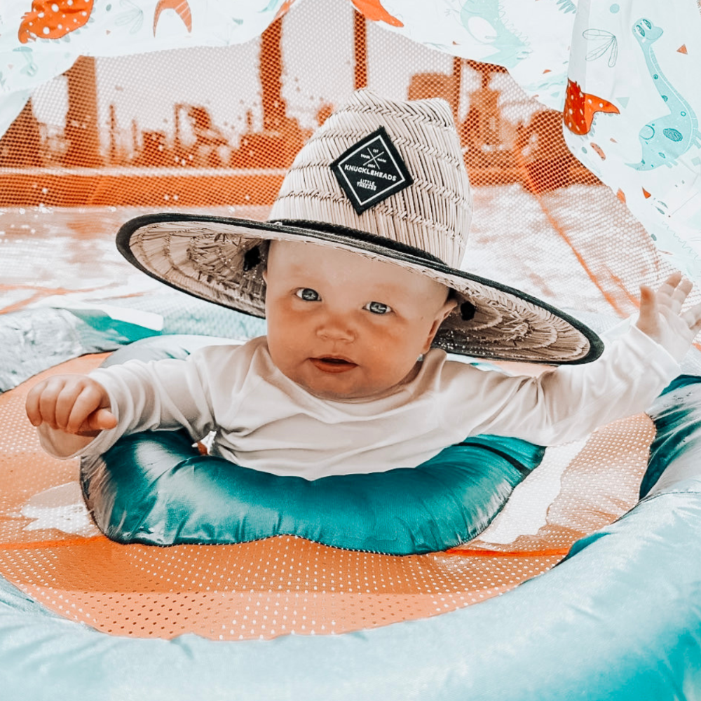 Image of a fashionable kids' straw hat featuring a distinctive Knuckleheads patch, elevating your child's outfit with a dash of unique style. This trendy accessory not only shields them from the sun's rays but also showcases their individuality. Whether they're headed to a picnic, a day at the beach, or any sunny adventure, this hat is the perfect addition to complete their look while keeping them cool and shaded.