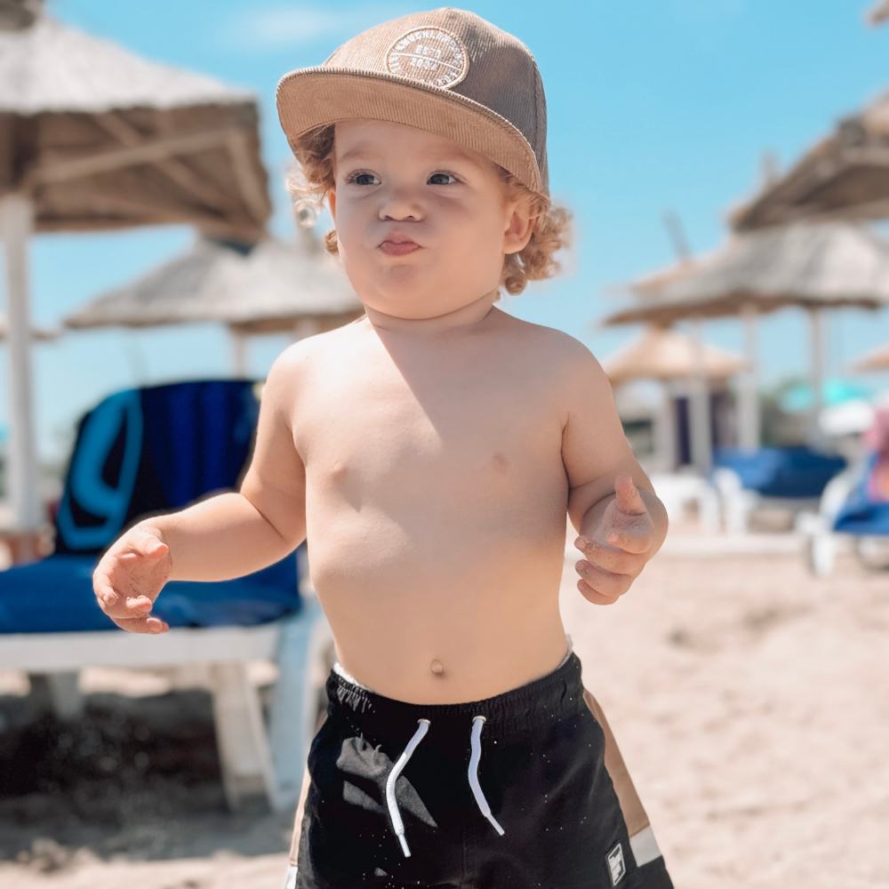 Introducing a Kids Trucker Hat in cozy Corduroy Camel, featuring an iconic Knuckleheads patch. This hat is specially designed for children, combining the warmth and style of corduroy with the classic Knuckleheads patch. A standout accessory in our collection, it adds a touch of charm and personality to your little one's look.