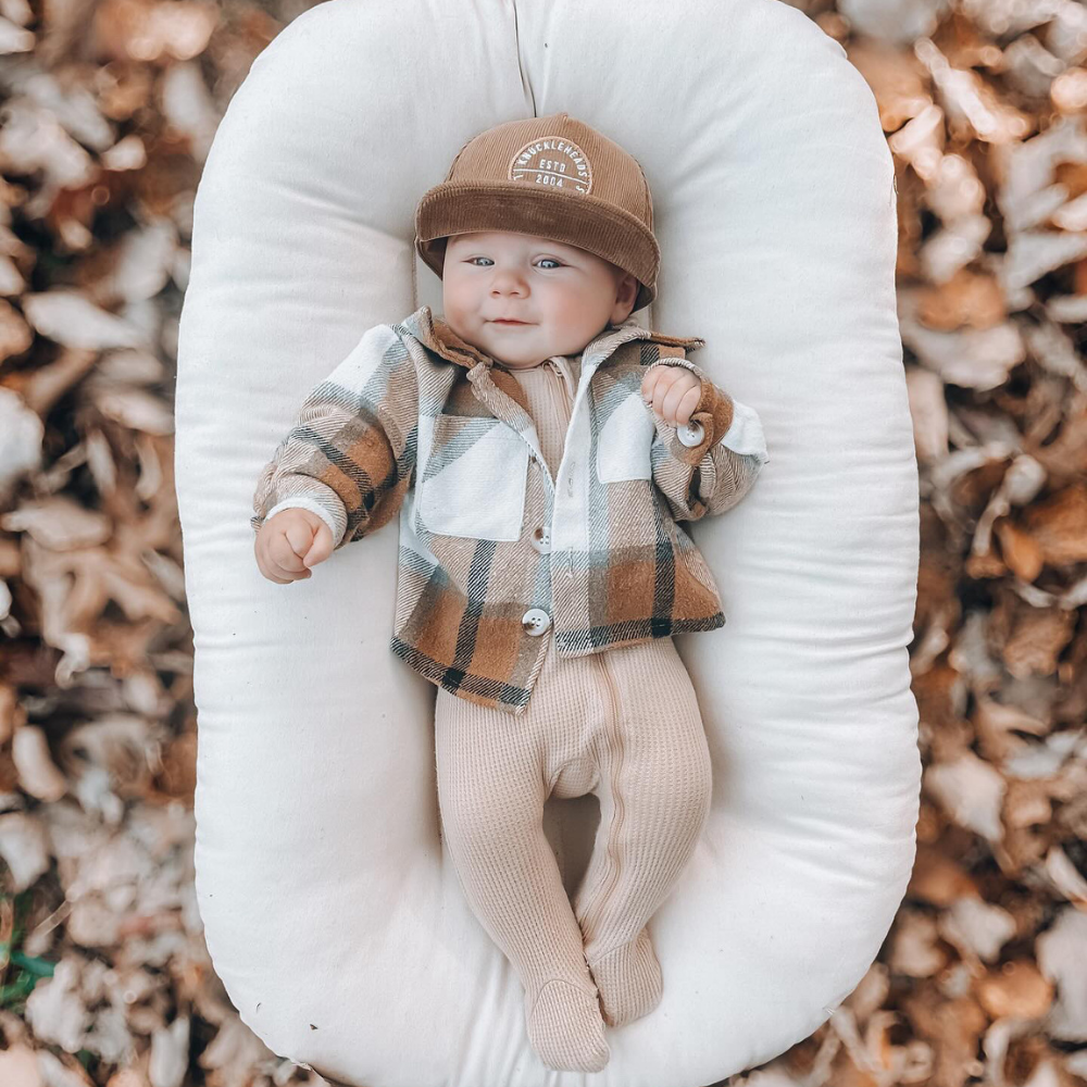 Introducing a Kids Trucker Hat in cozy Corduroy Camel, featuring an iconic Knuckleheads patch. This hat is specially designed for children, combining the warmth and style of corduroy with the classic Knuckleheads patch. A standout accessory in our collection, it adds a touch of charm and personality to your little one's look.