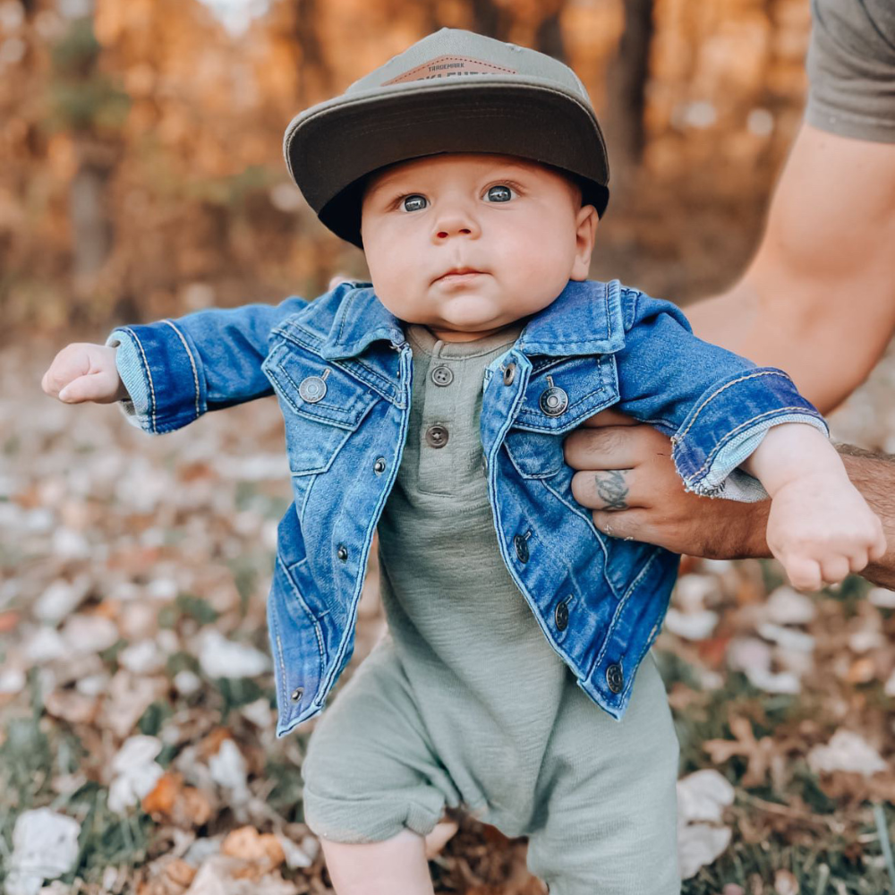 Image of Green Kids Trucker Hat with Knuckleheads Patch: A vibrant and stylish accessory designed for kids. In a lively green hue, it showcases a striking Knuckleheads patch on the front. Elevate your child's style with this fashionable hat, perfect for adding a pop of color to their outfits. Crafted with care, this green kids trucker hat with the Knuckleheads patch is a must-have addition to their wardrobe, suitable for various occasions and everyday wear.