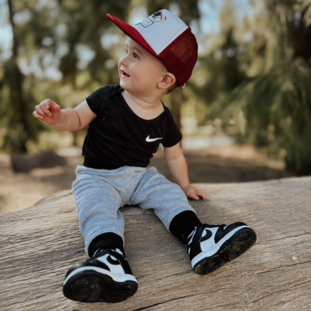 Image of Burgundy Kids Trucker Hat with California Republic Patch: A sophisticated and stylish accessory designed for kids. In rich burgundy, it showcases a captivating California Republic patch on the front. Elevate your child's style with this fashionable hat, perfect for expressing their allegiance to the Golden State.