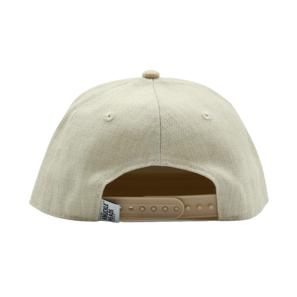 Introducing an Oat Kids Trucker Hat adorned with a classic Knuckleheads patch. This hat is designed for children, featuring a warm and inviting oat color complemented by the iconic Knuckleheads patch. A standout accessory in our collection, it adds a touch of style and personality to your little one's look.