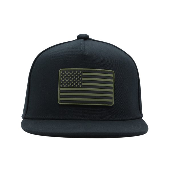 Image of Black USA Kids Trucker Hat with Green USA Flag Patch: A trendy and patriotic trucker hat designed for kids. The hat comes in sleek black, showcasing a unique green USA flag patch on the front. Elevate your child's style while proudly displaying their American spirit. Perfect for outdoor adventures and everyday wear, this hat is a fashionable and bold addition to their wardrobe.