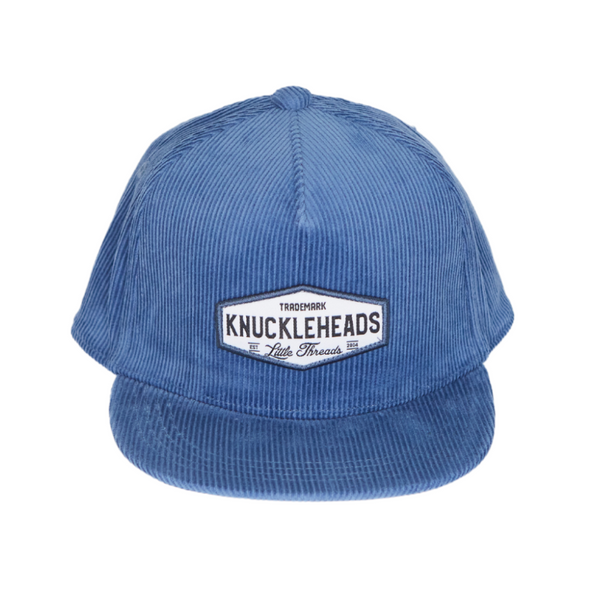 Image of Blue Corduroy Kids Trucker Hat with Knuckleheads Patch: A vintage-inspired and stylish accessory designed for kids. In a rich blue corduroy fabric, it showcases a striking Knuckleheads patch on the front. Elevate your child's style with this fashionable hat, perfect for adding a touch of texture to their outfits. 