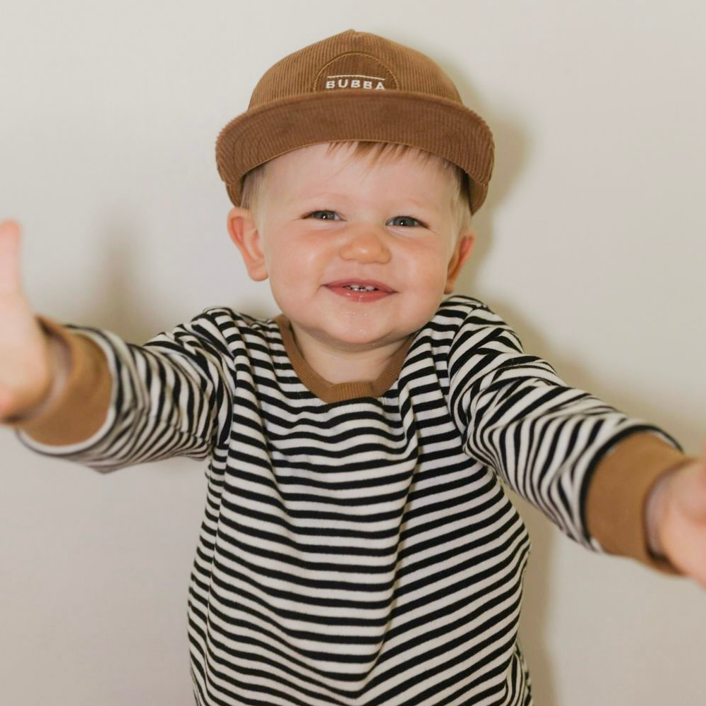 Image of Brown Corduroy Kids Trucker Hat with 'Bubba' Patch: A trendy and chic trucker hat designed for kids. The hat features a rich brown corduroy fabric and showcases a charming 'Bubba' patch on the front. Made with no sun mesh for a comfortable and breathable wear. Perfect accessory to elevate your child's style while providing sun protection.