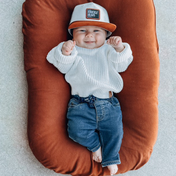 Stoked Snapback: A stylish and comfortable 100% cotton hat for infants and toddlers. Features a medium profile, structured 5-panel crown, flat bill, and adjustable snapback closure for a perfect fit as your little one grows. Bold Knuckleheads patch adds a cool touch.