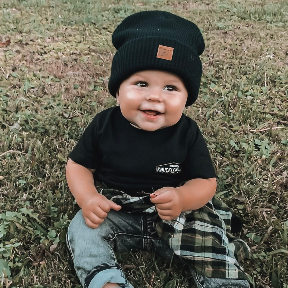 infant wearing black beanie