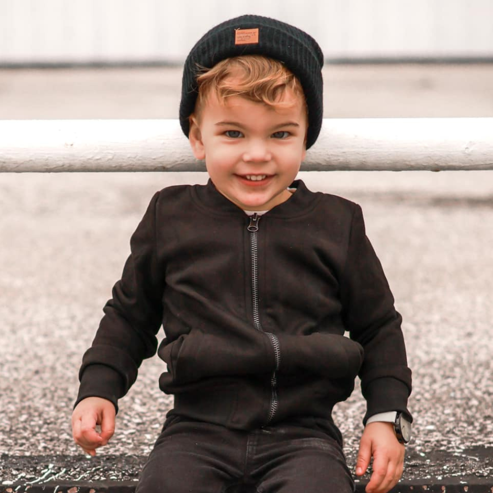 toddler with black beanie