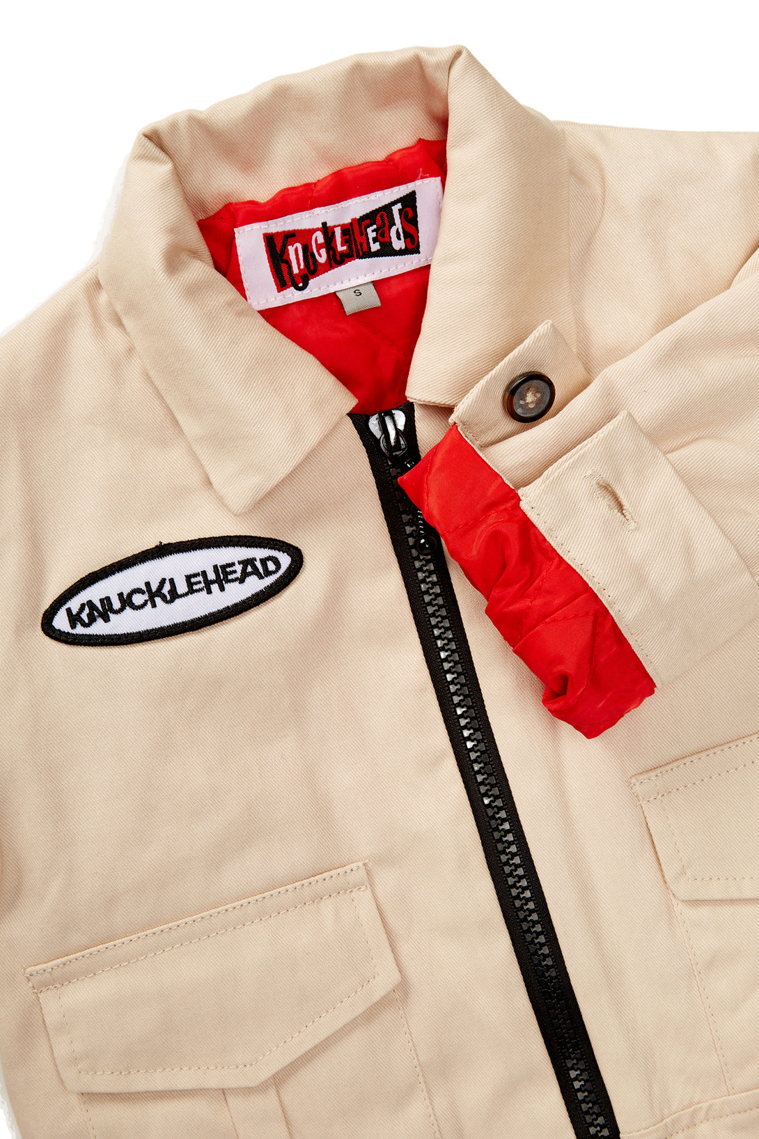 Tan Knuckleheads Mechanic Jacket with long sleeves, featuring the Knuckleheads logo. Perfect for keeping your little one warm and stylish. Available in sizes S to XXL for kids aged 6 months to 8 years.