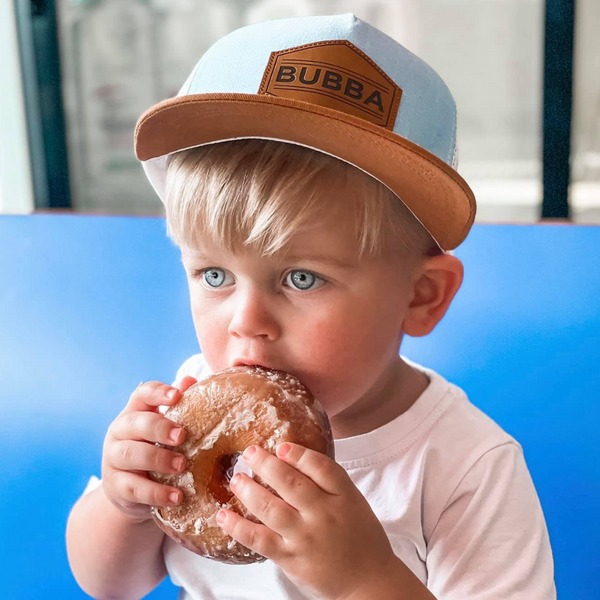 Image of Baby Blue Kids Trucker Hat with 'Bubba' Patch: A charming and stylish accessory designed for kids. In a delightful baby blue hue, it features a playful 'Bubba' patch on the front. Elevate your child's style with this fashionable hat, perfect for adding a touch of color to their outfits. Crafted with care, this baby blue kids trucker hat with the 'Bubba' patch is a must-have addition to their wardrobe, suitable for various occasions and everyday wear.